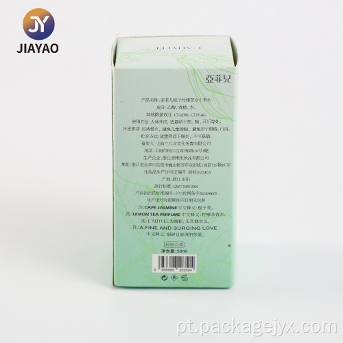 Design elegante de caixa de perfume com folhas verdes